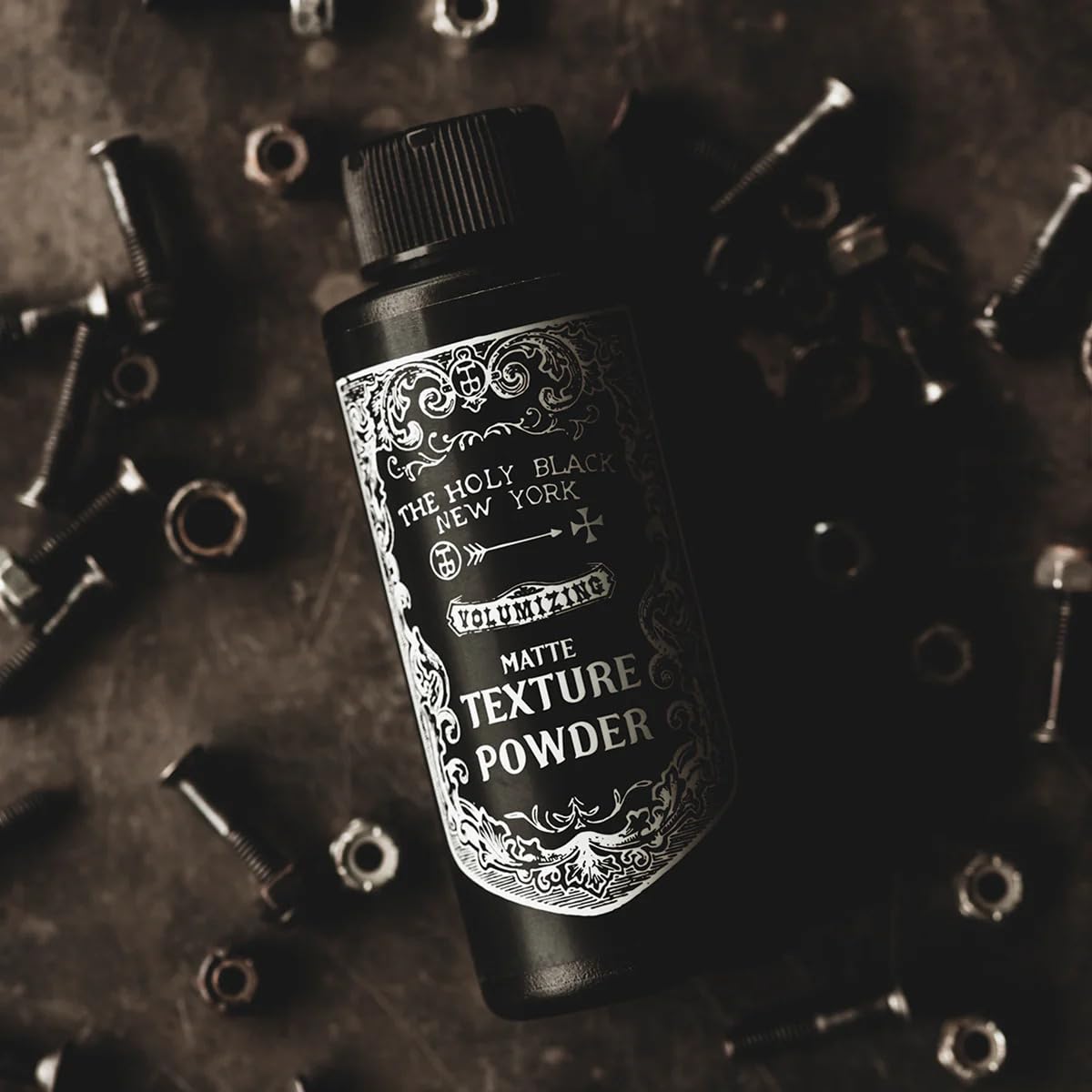The Holy Black Matte Texture Powder on-the-go compact for quick styling.