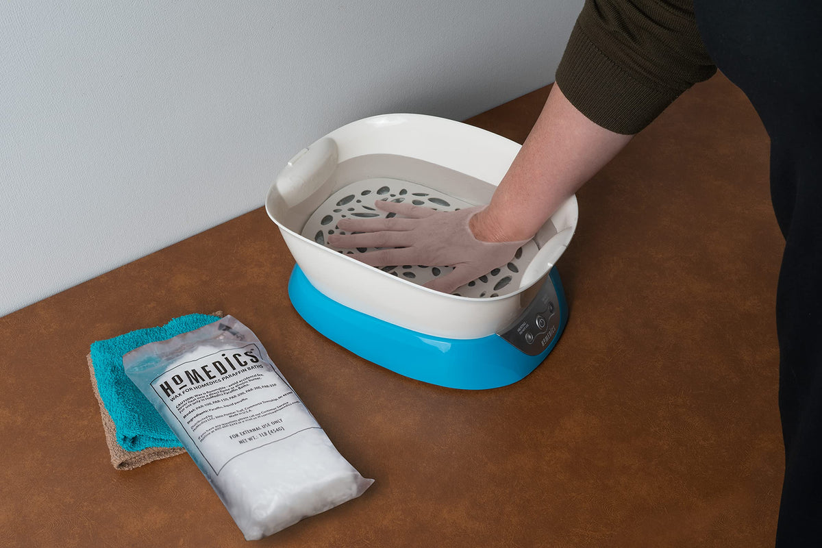 Feet treatment with HoMedics paraffin bath refill to moisturize
