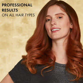 Hot Tools 24K Gold digital curling iron — digital display shows precise temperature control.