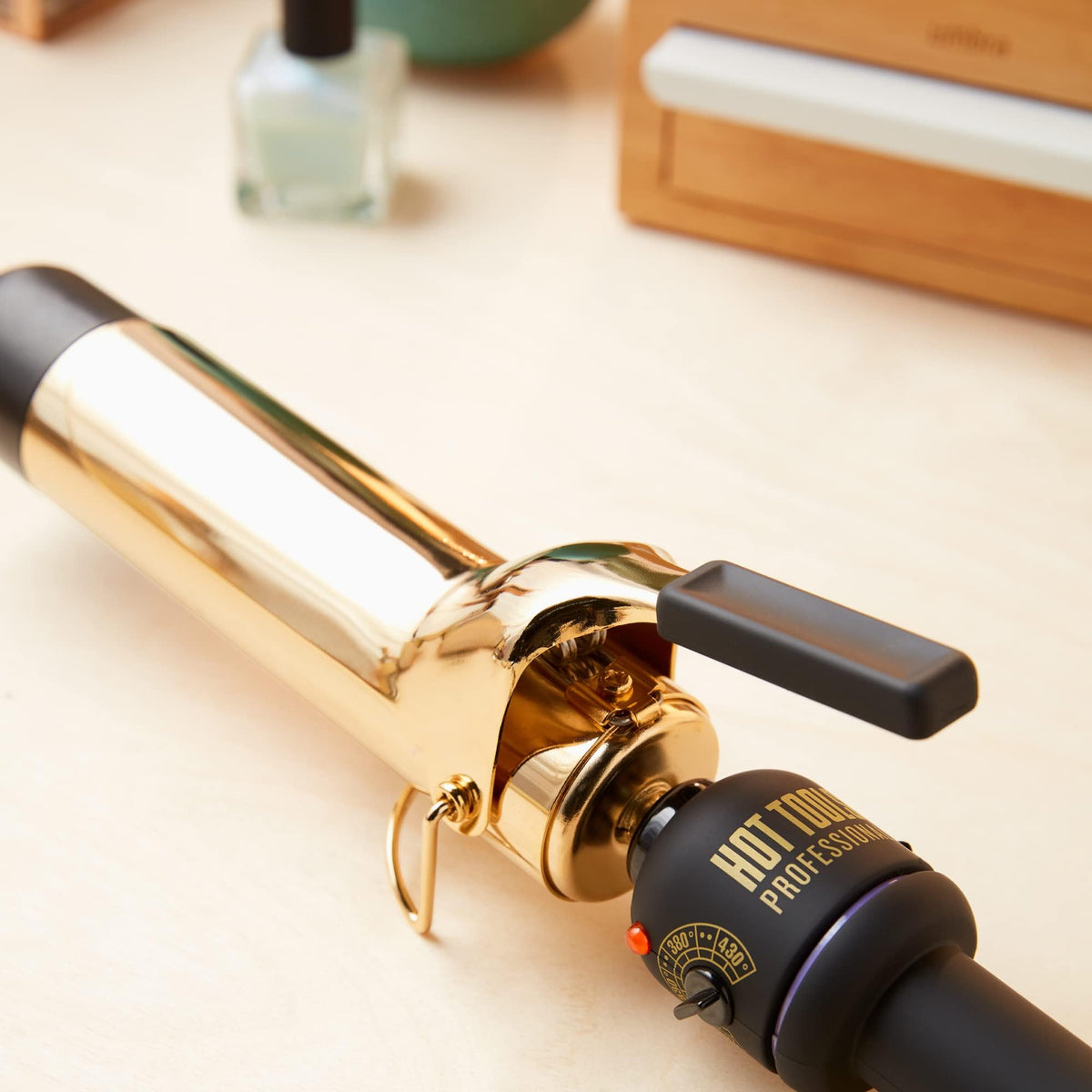 HOT TOOLS Pro Artist 24K Gold Curling Iron foldaway stand provides safe rest between passes