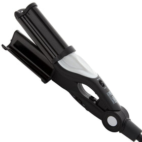 Hot Tools Pro Artist Nano Ceramic Deep Waver barrel close-up showing smooth surface for frizz-free shine.