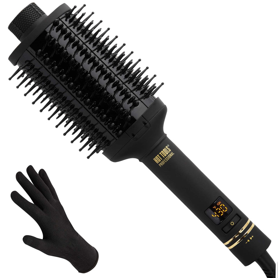 Hot Tools Pro Artist Oval Brush close-up showing the Black Gold surface for even heat