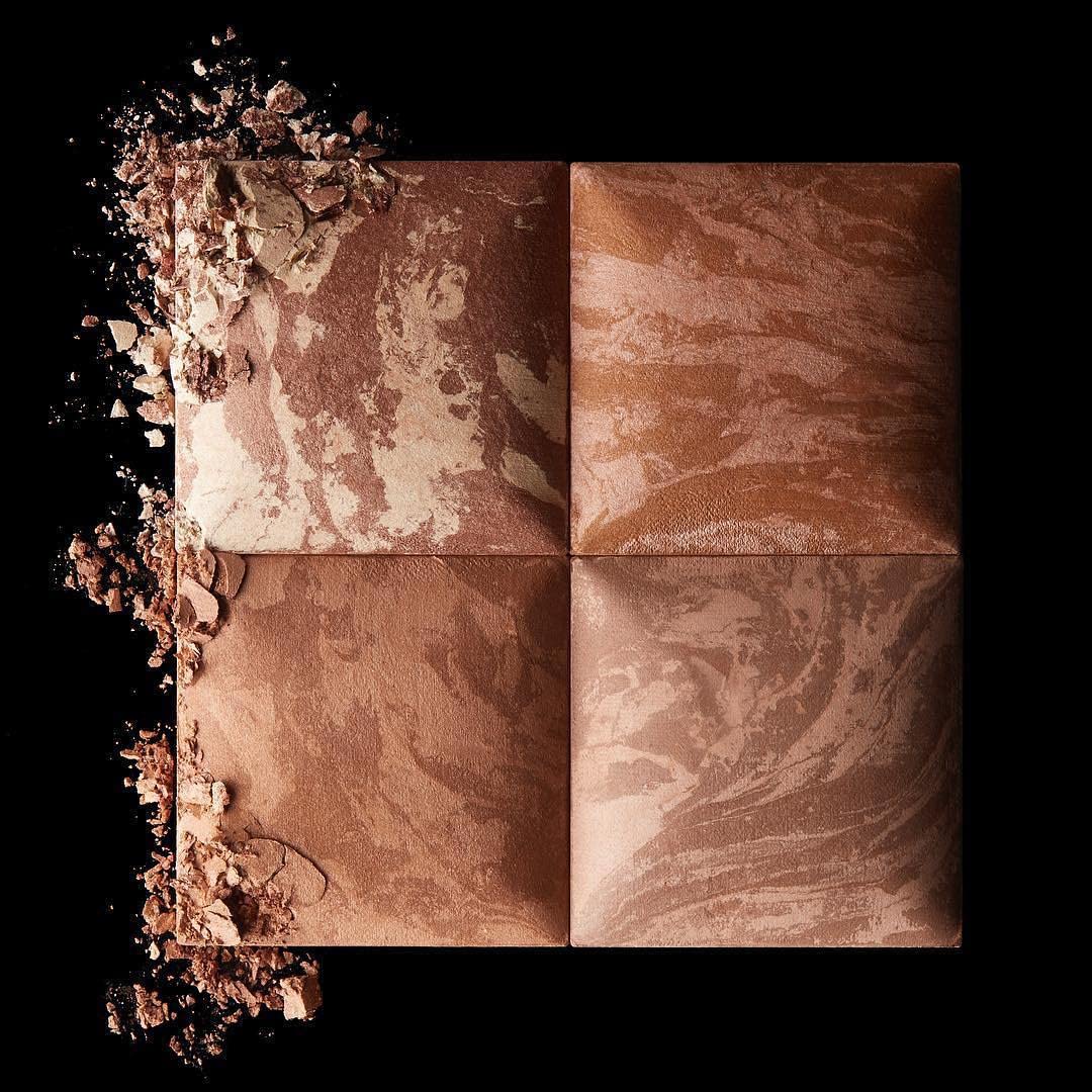 Hourglass Ambient Lighting Bronzer Nude Bronze Light on cheek demonstrates sun-kissed depth and dimension.