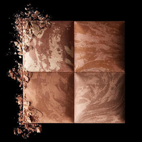 Hourglass Ambient Lighting Bronzer Nude Bronze Light on cheek demonstrates sun-kissed depth and dimension.