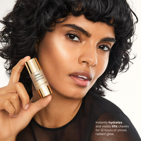 Hourglass Unreal Liquid Highlighter showcases silky, hydrating texture on skin.