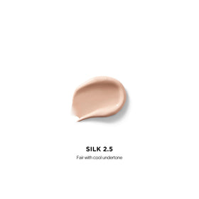 Hourglass Vanish Airbrush Concealer in action for seamless blending.