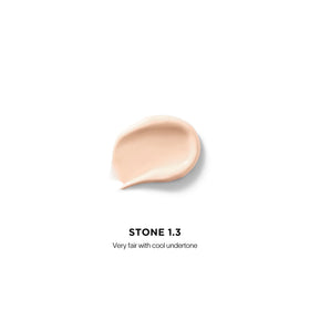 Hourglass Vanish Airbrush Concealer applicator for precise under-eye brightening.