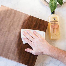 Howard BBC012 conditioner applied to a cutting board to nourish wood.