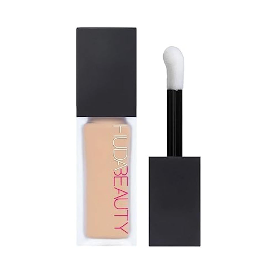 HUDA BEAUTY FauxFilter Concealer in Coconut Flakes 2.7 Neutral provides long-lasting, crease-proof coverage.