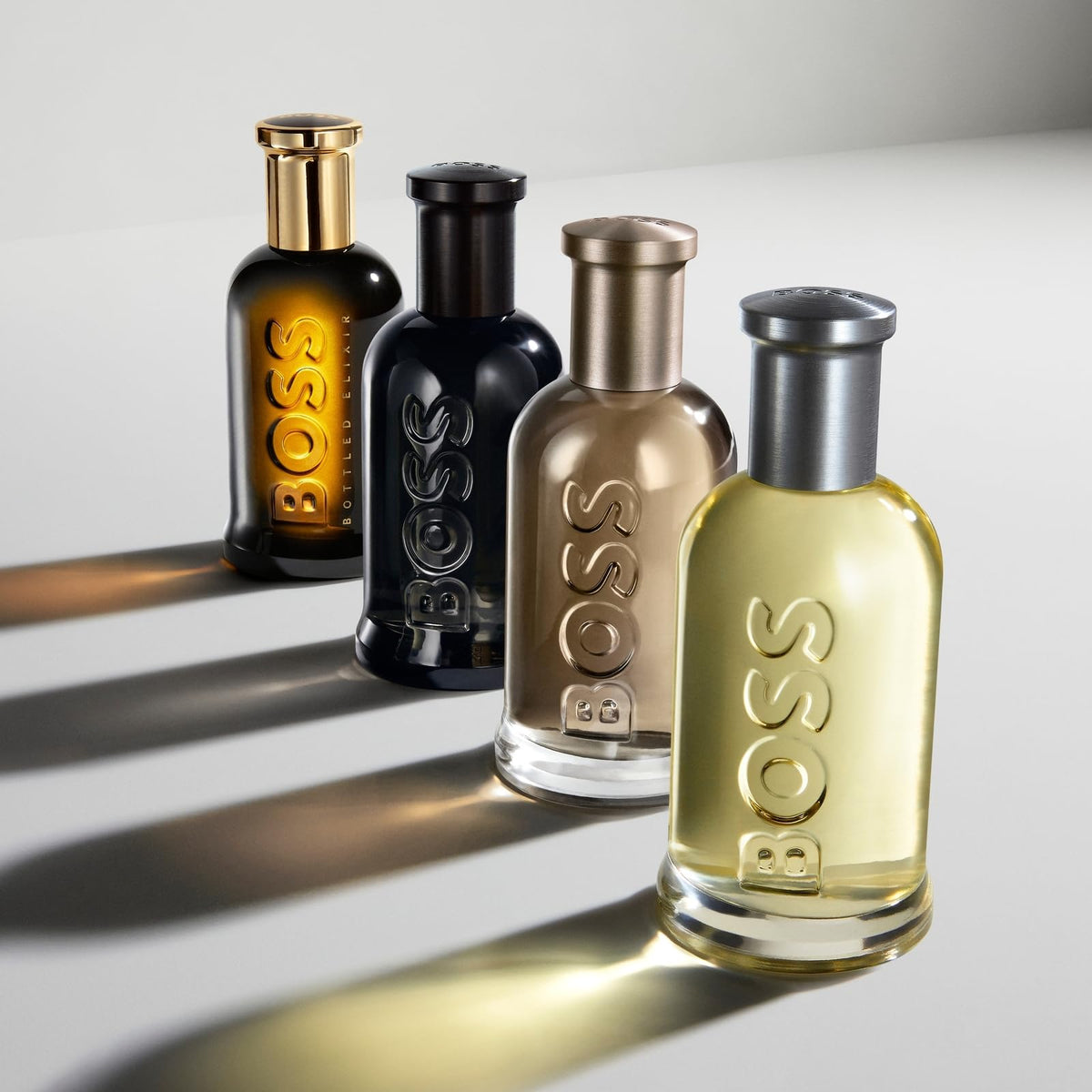 Hugo Boss Bottled Parfum ice-gold packaging emphasizes premium presentation on shelf.