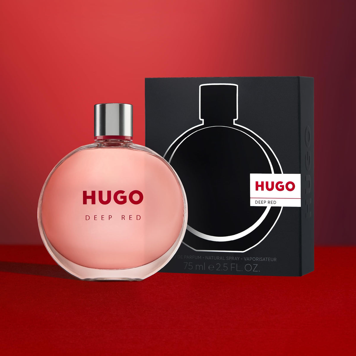 Hugo Boss Deep Red spray nozzle and cap in focus suggests precise, travel-friendly application