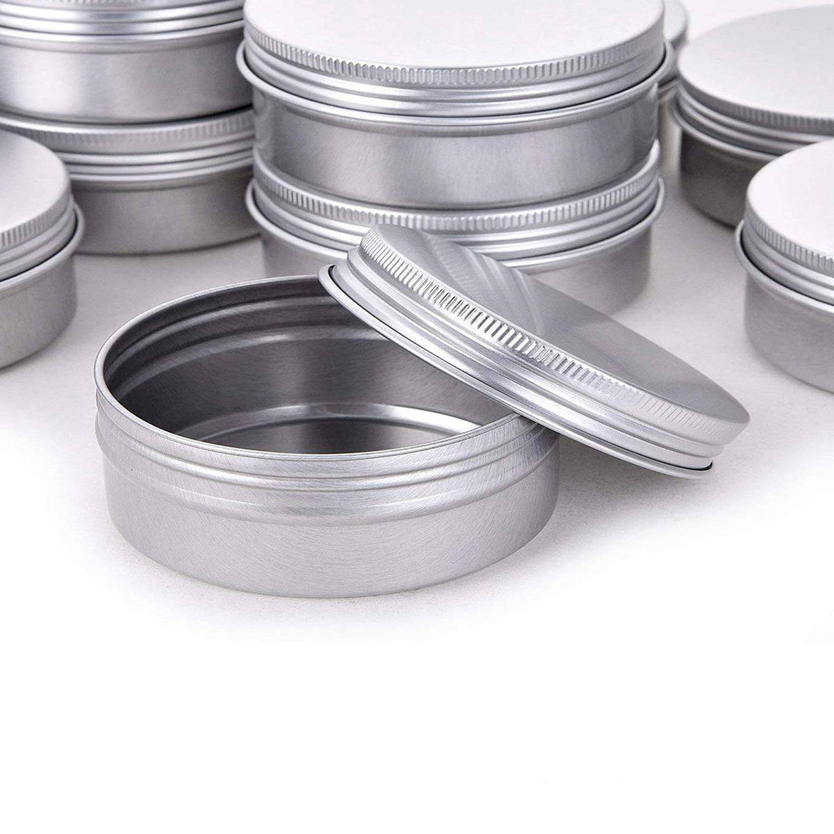 Hulless 12-pack aluminum tins ready for DIY cosmetics, balms, or art supplies.