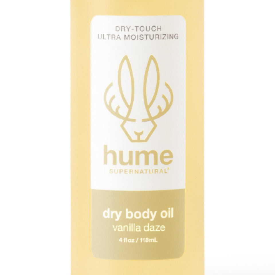 HUME SUPERNATURAL Dry Body Oil Spray bottle close-up showing lightweight hydration