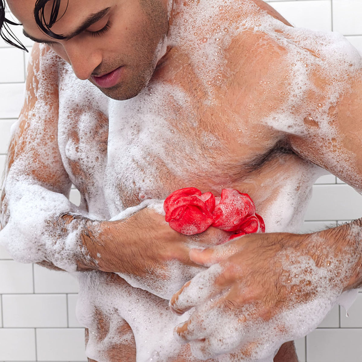 User applying body wash in shower highlights easy daily routine.