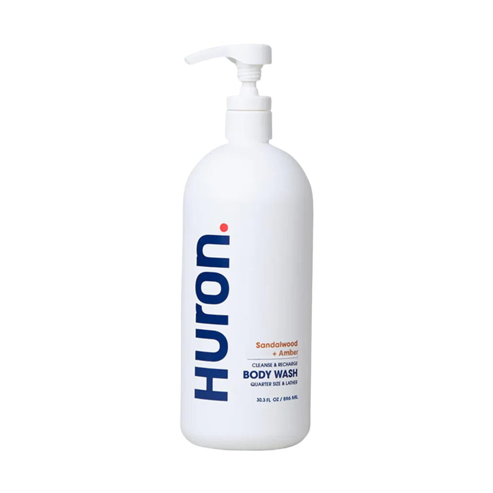 Huron body wash bottle front highlighting unisex formula for daily use.