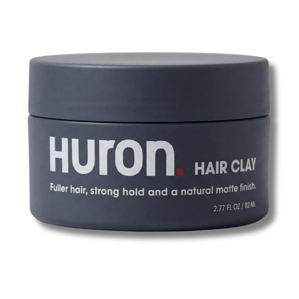 Huron Hair Clay jar close-up shows premium matte finish for natural texture.