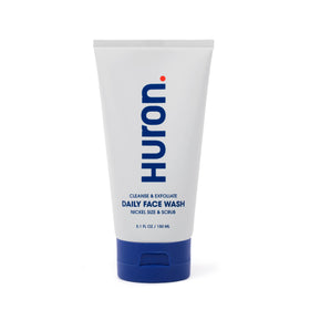 Huron Men’s Face Wash bottle close-up showing energizing scent for daily freshness.