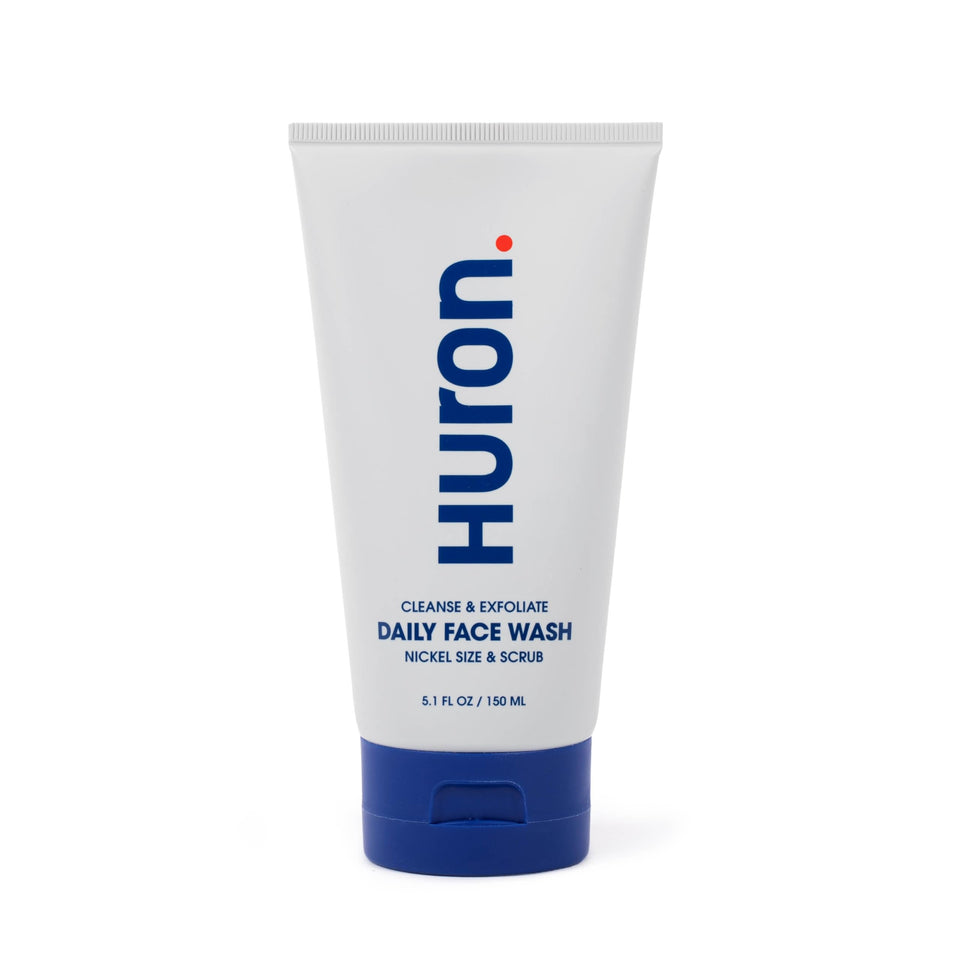 Huron Men’s Face Wash bottle close-up showing energizing scent for daily freshness.