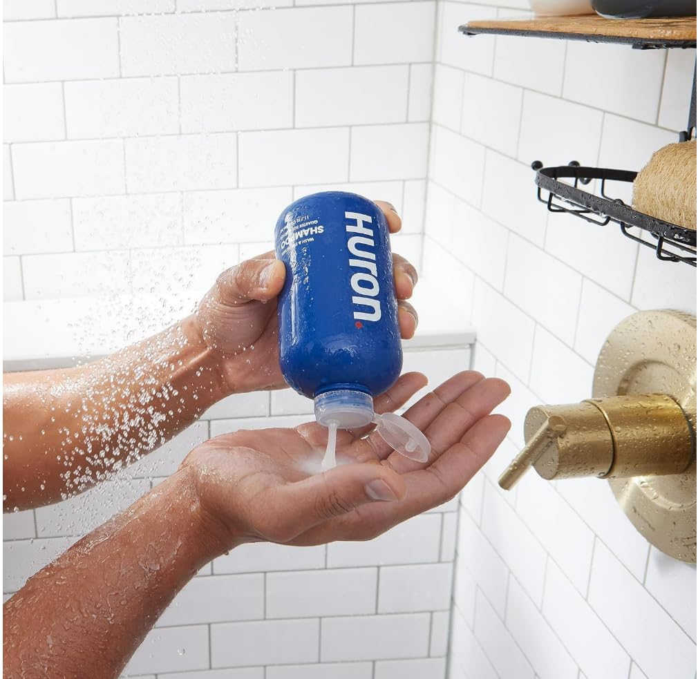 Huron shampoo damp-hair application demonstrating hydrating and strengthening effects