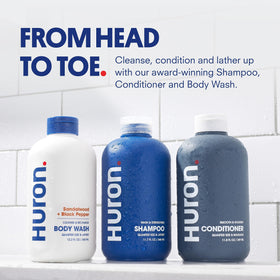 Close-up of Huron Shampoo bottle in the shower kit