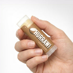 Tactile cap of Hurraw! Coconut Lip Balm for secure travel.