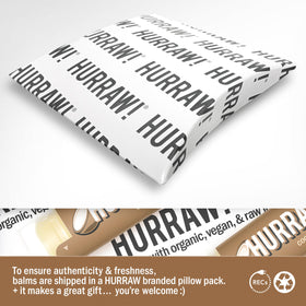 Open Hurraw! Coconut Lip Balm tube ready for daily use.