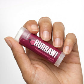 Hurraw! Hazelnut tinted lip balm tube for warm sunset-brown tint.