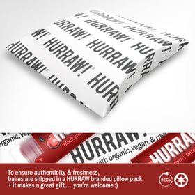 Hurraw! balm being applied to lips to show tint and glide.