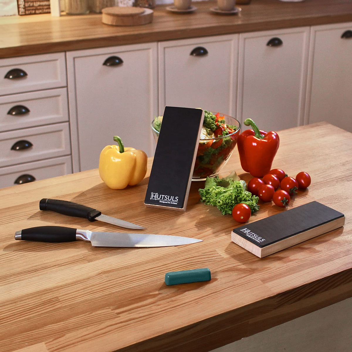 Hutsuls knife-edge honing on strop for versatile blades like kitchen and pocket knives.