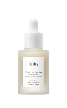 Huxley Secret of Sahara Oil Essence bottle closeup showing sleek packaging and easy daily use.