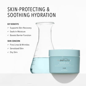 Applying HydroPeptide Recovery Therapy Balm to the cheek for dry skin relief