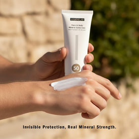 HygieneLab SPF 50 mineral sunscreen beside beach gear.