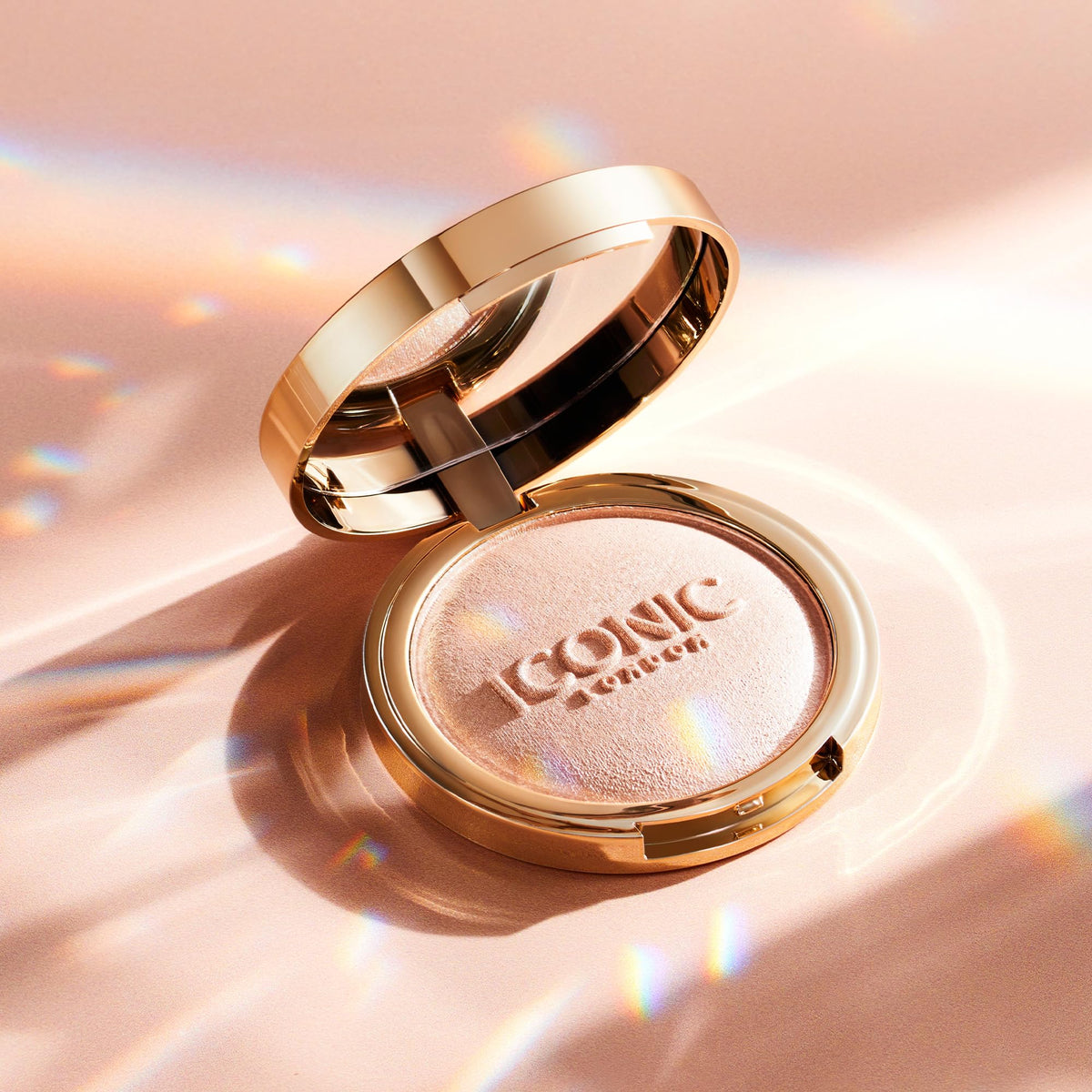 Compact highlighter as a handbag hero for on-the-go touch-ups.