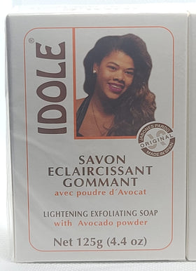 Close-up of Idole exfoliating soap bar reveals avocado seed powder texture for smoothing.