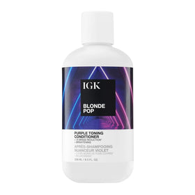 IGK Blonde Pop purple-toning conditioner bottle demonstrates brass-neutralizing action for cooler blonde tones.