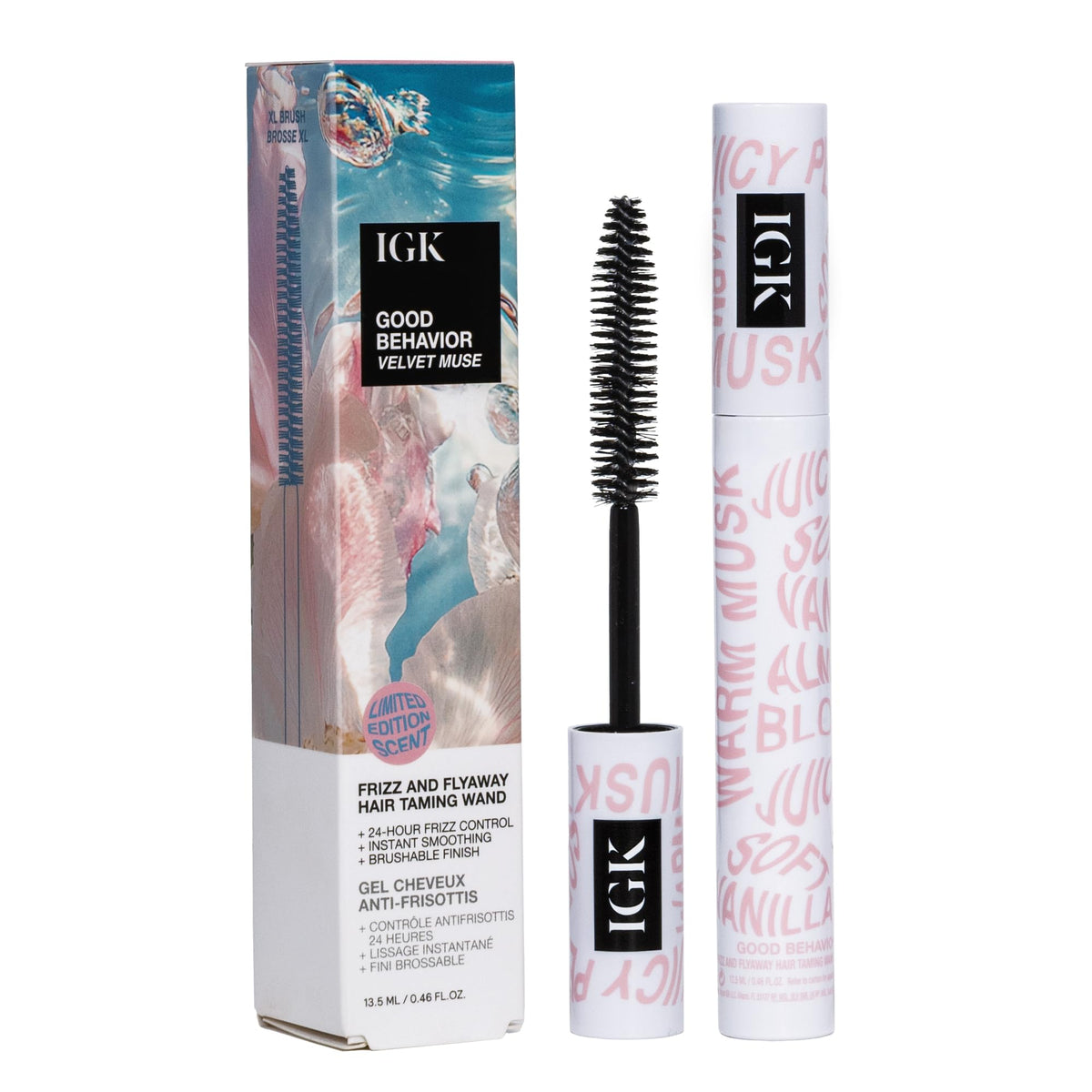IGK Velvet Muse wand in use smoothing flyaways for a sleek finish