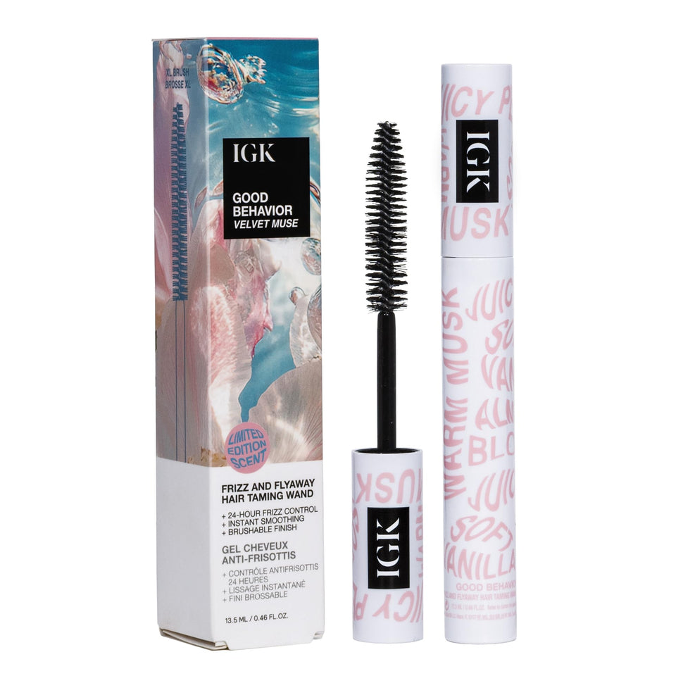 IGK Velvet Muse wand in use smoothing flyaways for a sleek finish