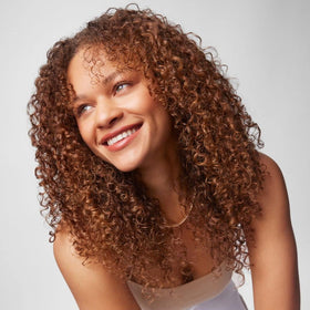 IGK Good Spin after-use hair with subtle shine and frizz-free finish.