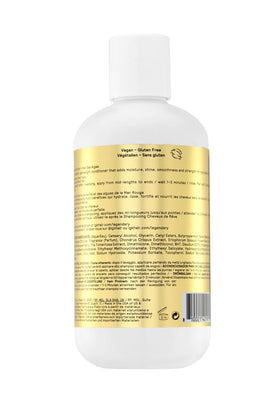 IGK conditioner being applied to mid-lengths for detangling.