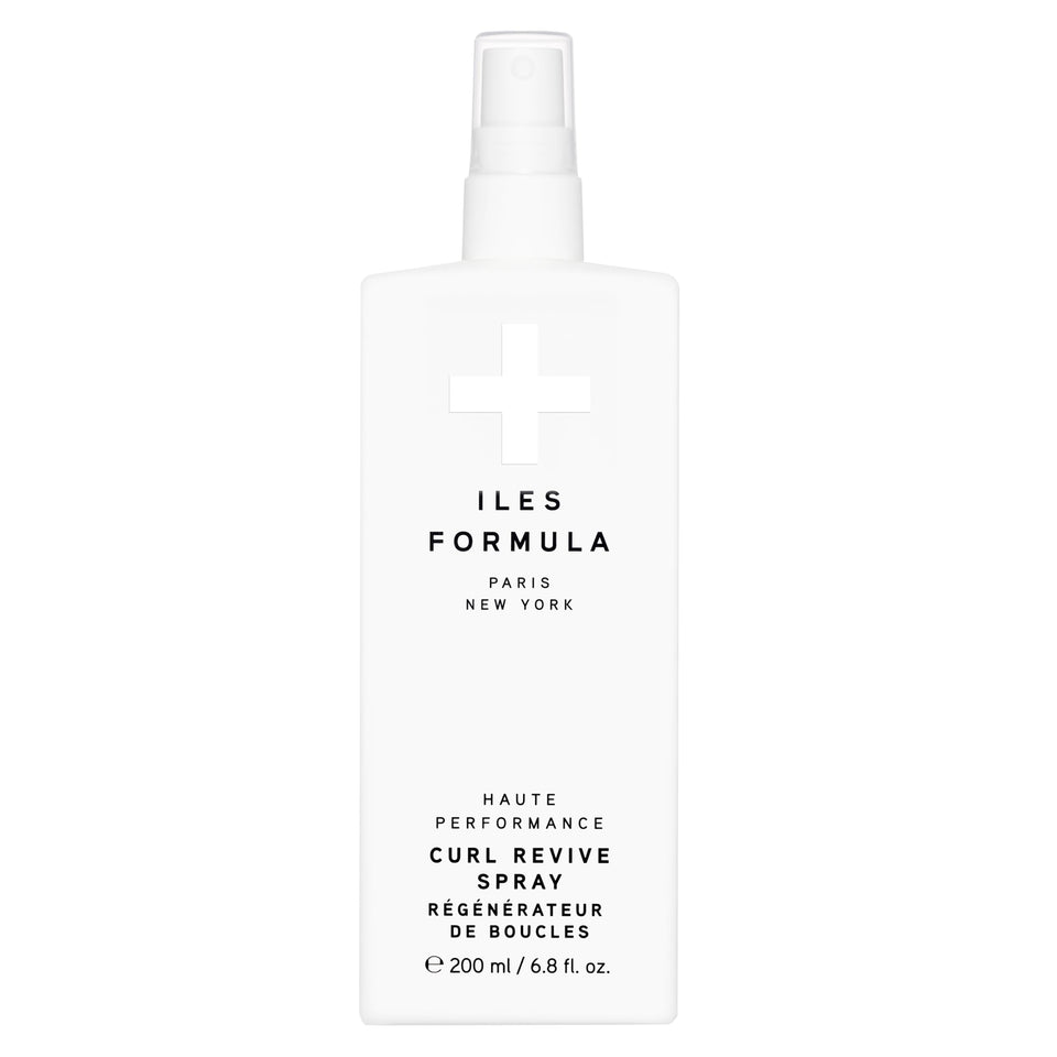 ILES FORMULA Curl Revive bottle pour shows lightweight cream for soft curl definition.