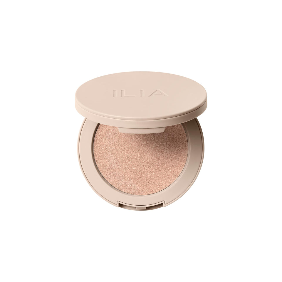 ILIA Lightshift Cream Highlighter on the cheekbone for a soft champagne glow (Glint).
