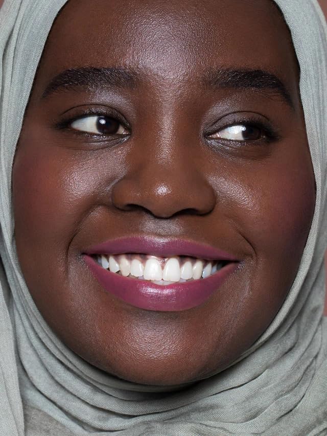 ILIA Multi-Stick fingertips applying lip and cheek color