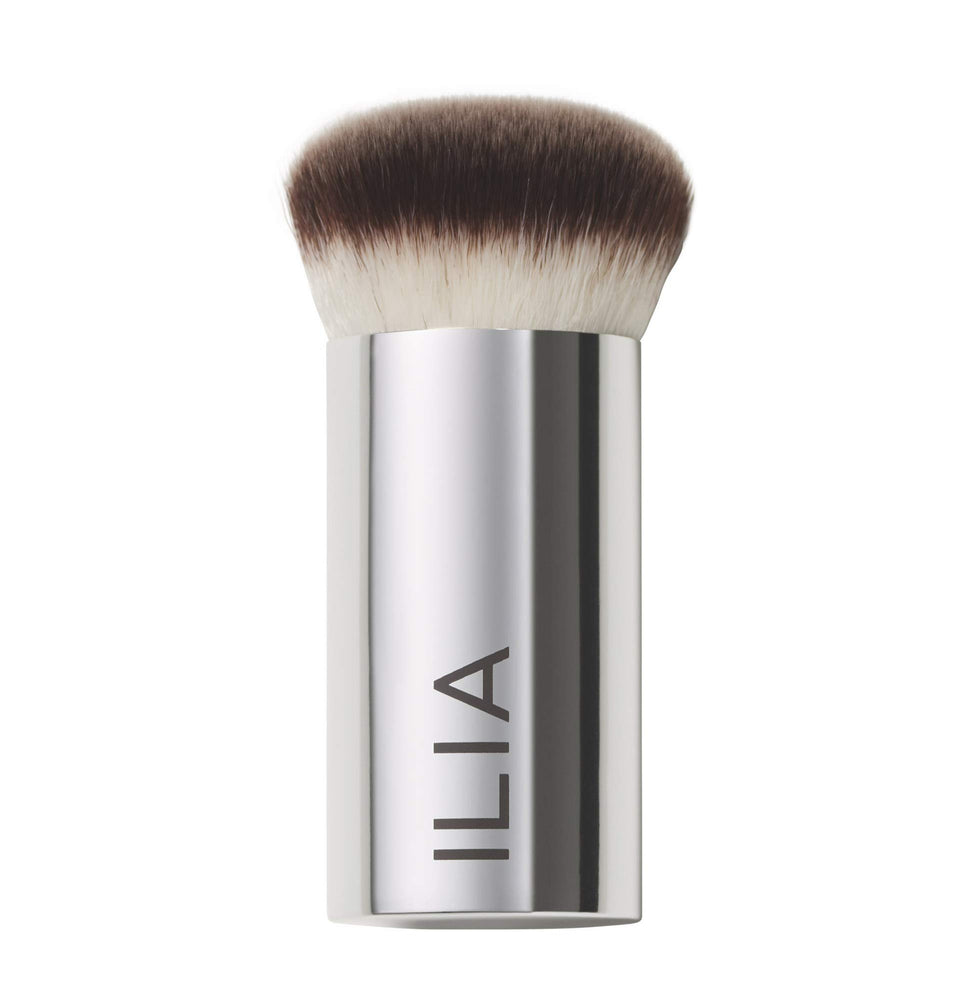 ILIA Perfecting Buff Brush with aluminum handle for seamless cream blending and a smooth finish.