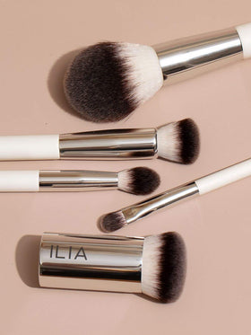 ILIA Perfecting Buff Brush being cleaned easily with mild soap and warm water.