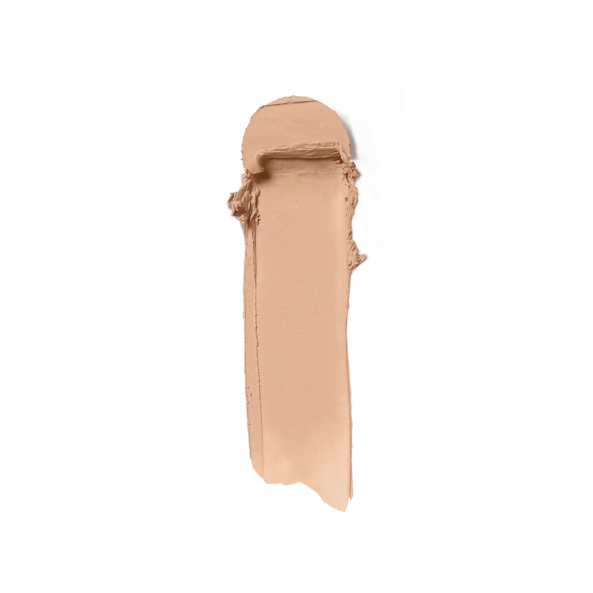 ILIA Skin Rewind Complexion Stick application on cheek shows buildable coverage.