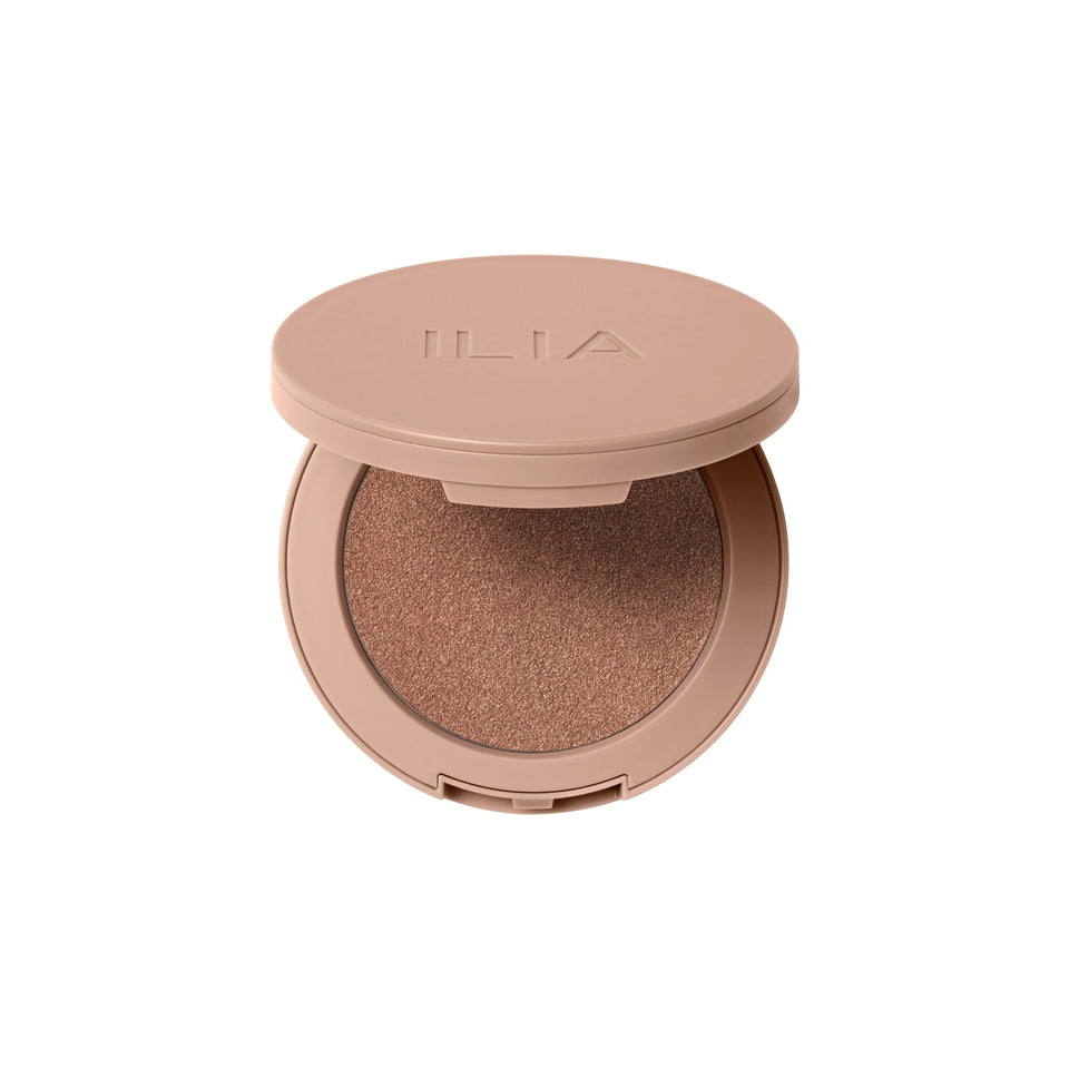 ILIA Sunshift Eclipse swatch shows peachy warmth on skin, ideal for a natural glow