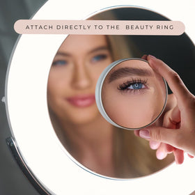 Ilios Lighting magnetic-design compact makeup mirror attaches to metal surfaces for hands-free use.