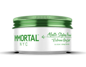 Immortal NYC Matte Styling Extreme Dry Look Pomade packaging highlights easy washout and natural formula.