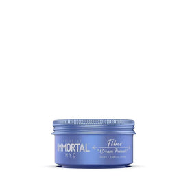 Hands applying Immortal NYC Fiber Cream Pomade for easy wash