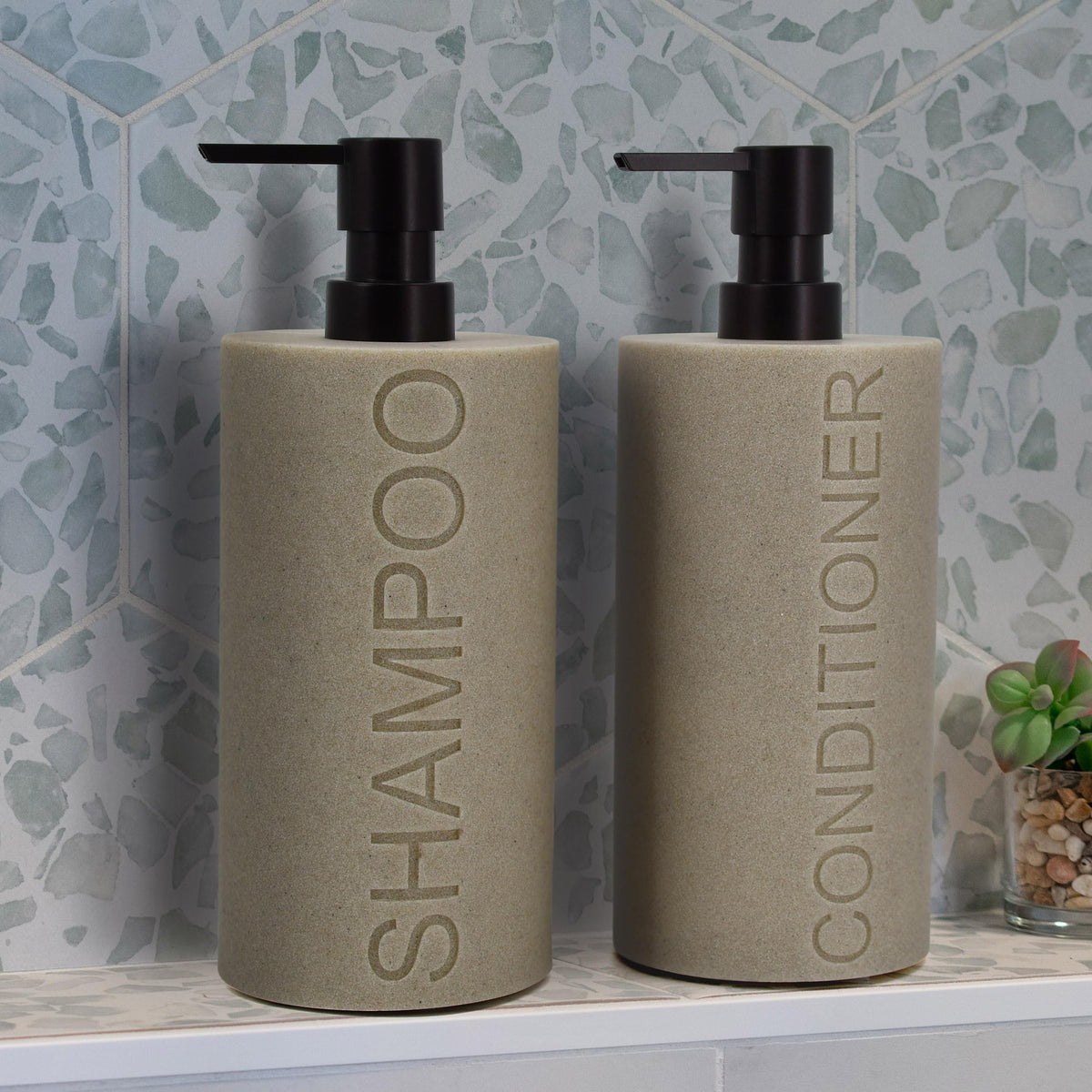 Indecor Home dispenser close-up showing embossed CONDITIONER text, premium feel.